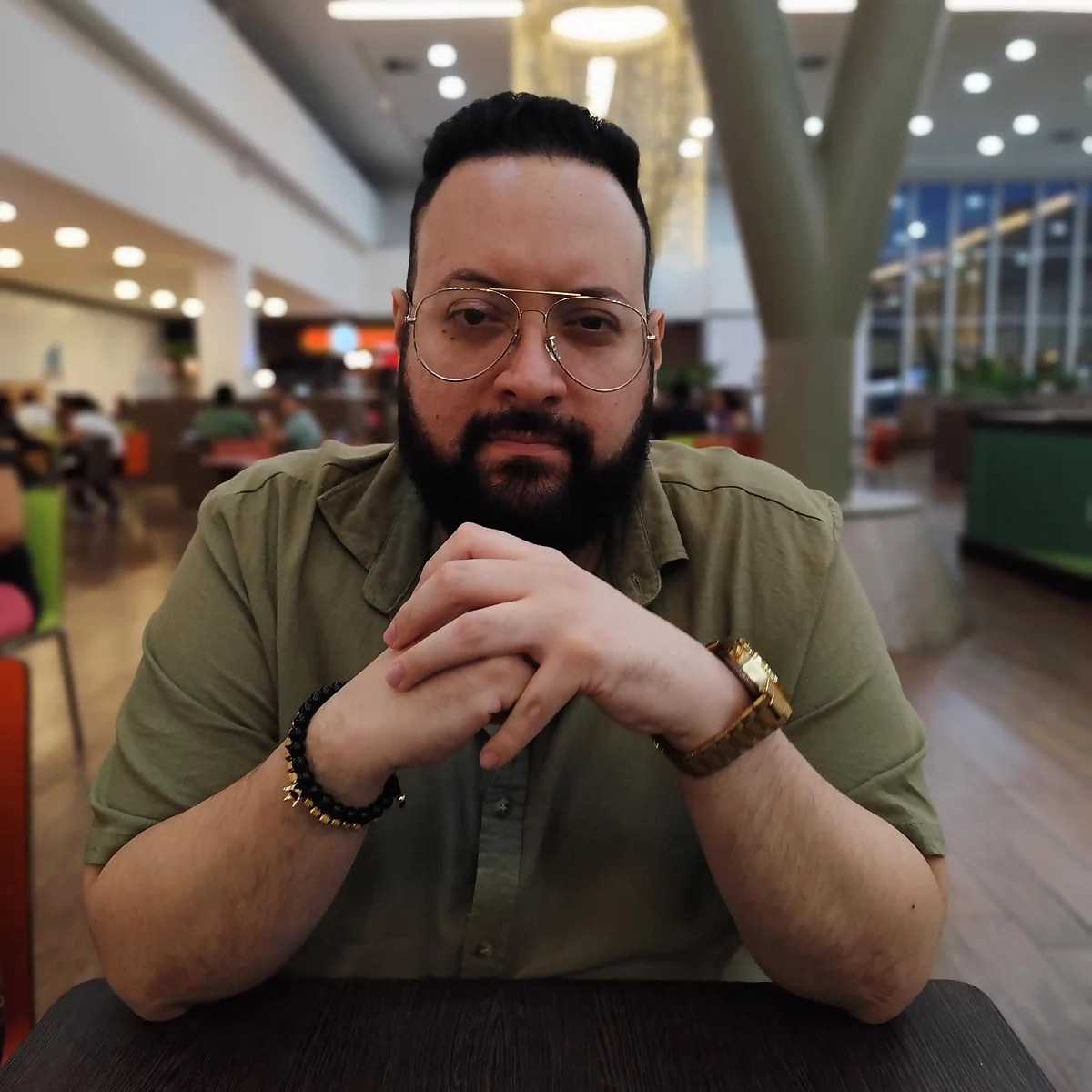 Portrait of Abilio de Abreu, the partner who bought Hot Music and turned it into “La Fuerza,” in glasses and a green shirt