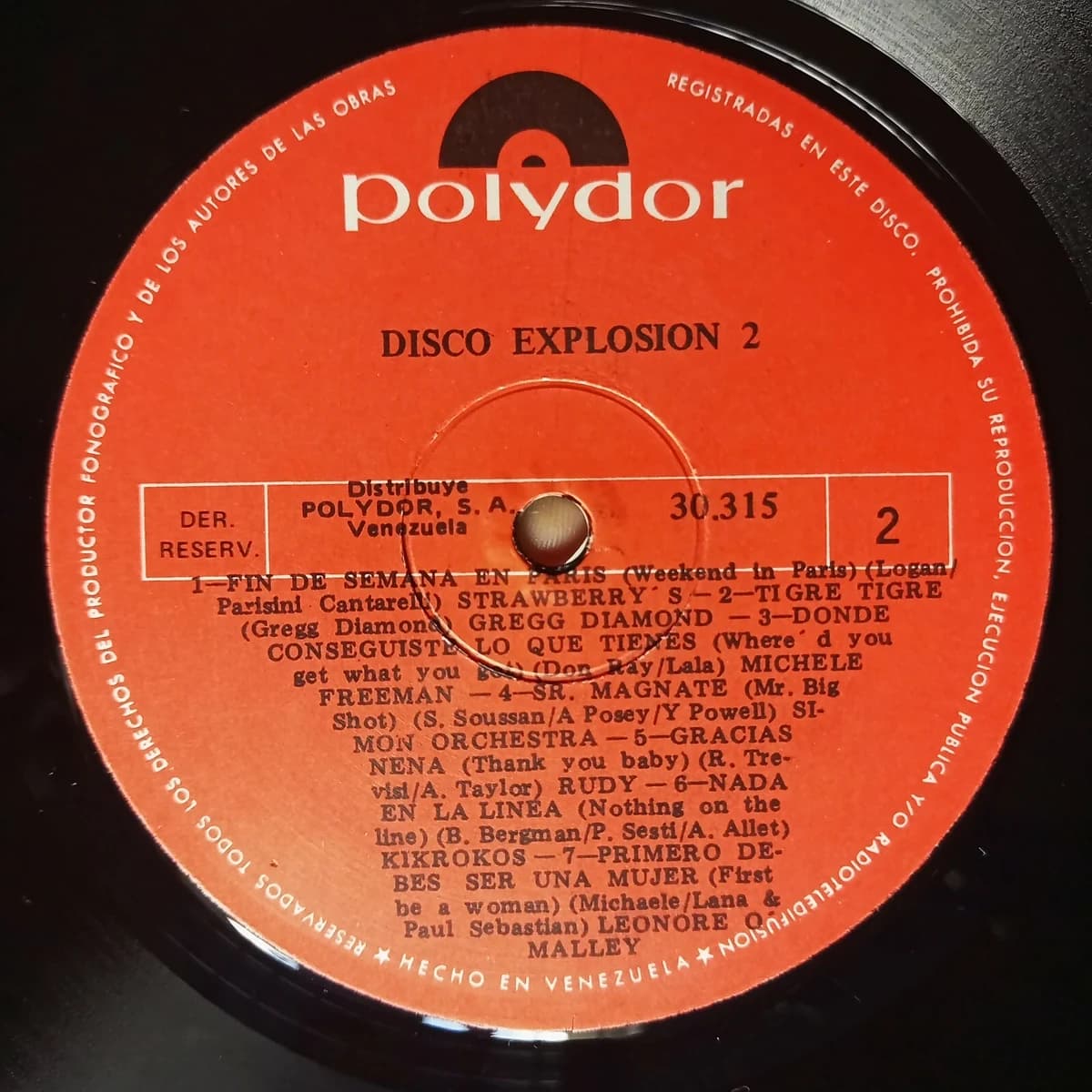 Disco Explosion Vol. 2 — Archivo CMTK Etiqueta naranja de Polydor del Lado 2 de «Disco Explosion 2», con los siete temas del lado y sus compositores